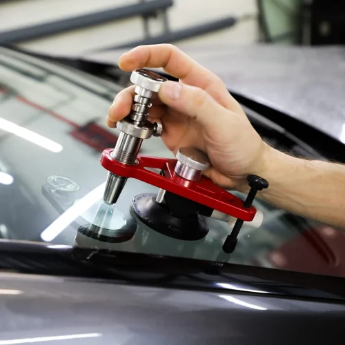 man repairing the windscreen