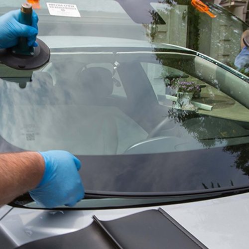 man inserting windscreen