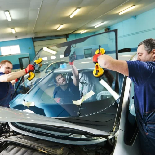 workers replacing windscreen